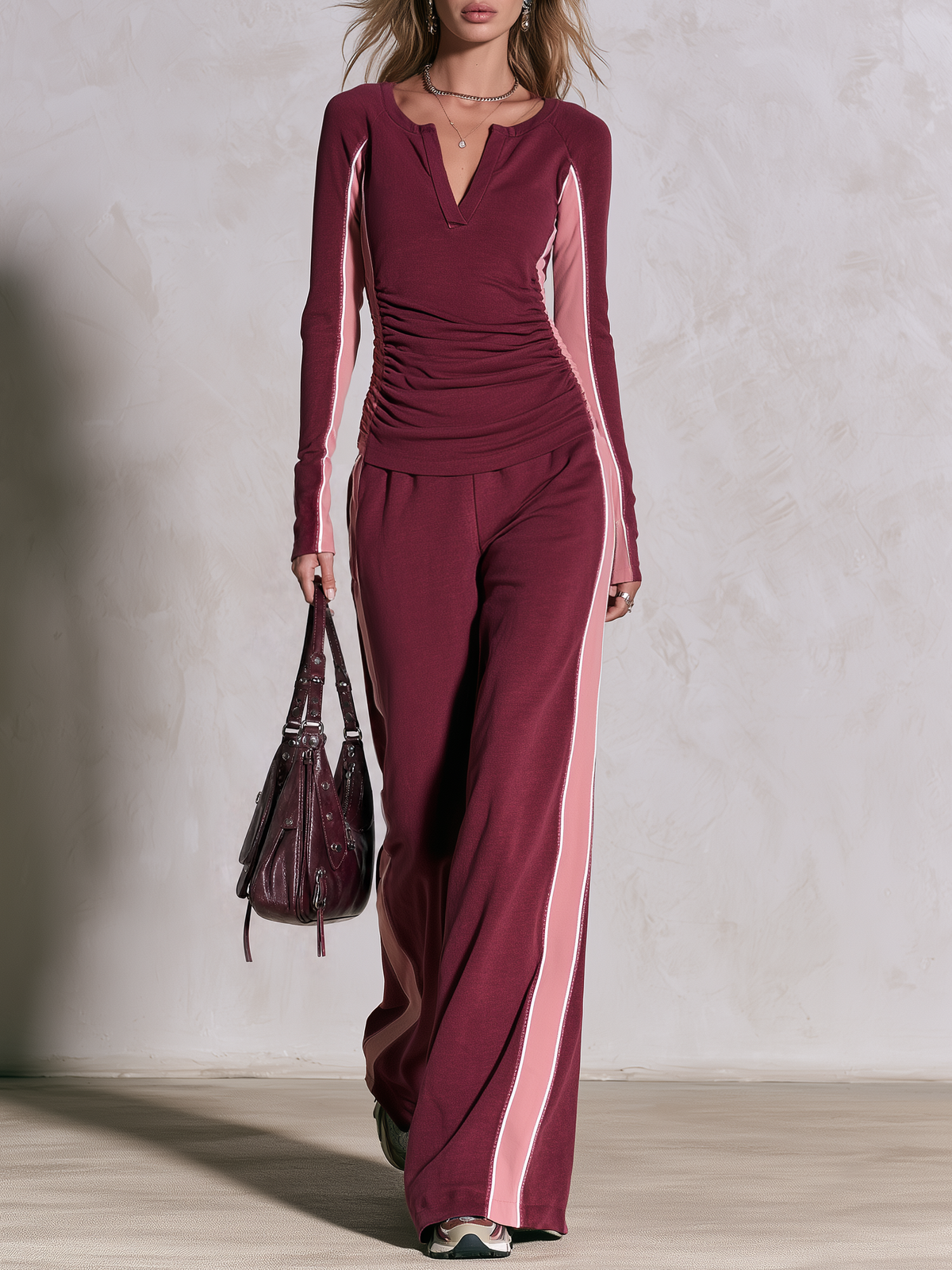 Retro burgundy and pink color-block sweatshirt and wide-leg pants track set for women by Oyrosy Clothing, styled on a model.