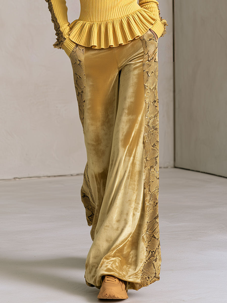 Women’s yellow knitted hooded top with ruffles and snakeskin velvet pants set from Oyrosy Clothing, styled for fashionable comfort.