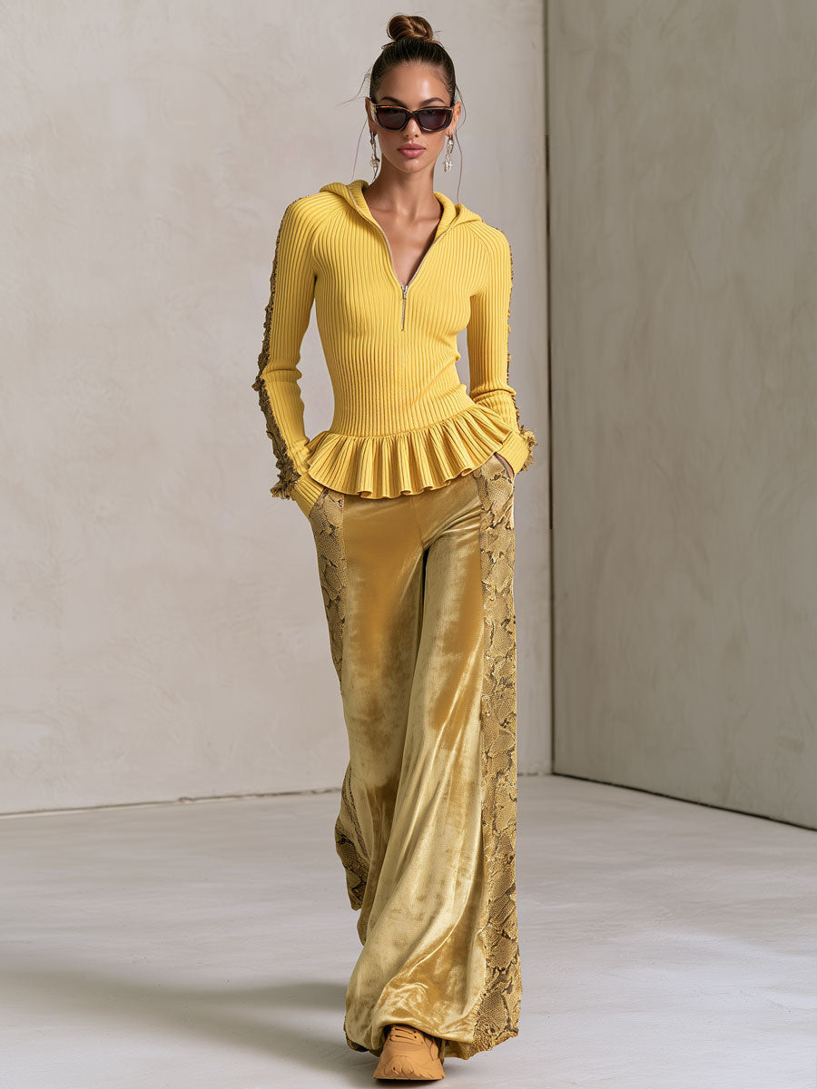 Yellow knitted hooded top with ruffles paired with snakeskin velvet pants, stylish women's clothing by Oyrosy Clothing.