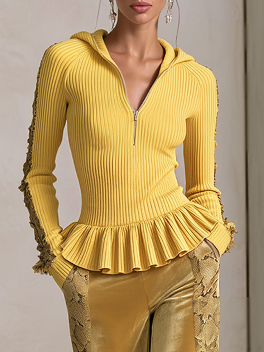 Women's yellow knitted hooded top with ruffles paired with snakeskin velvet pants, stylish outfit by Oyrosy Clothing