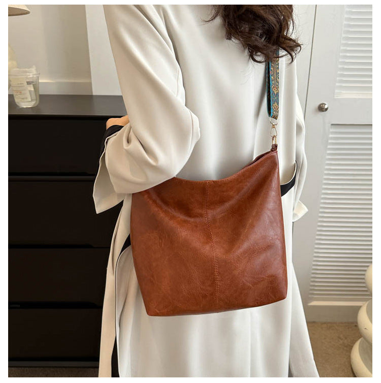 Women's Convertible Crossbody Bucket — Monochrome PU Carryall with Artisan-Embroidered Strap