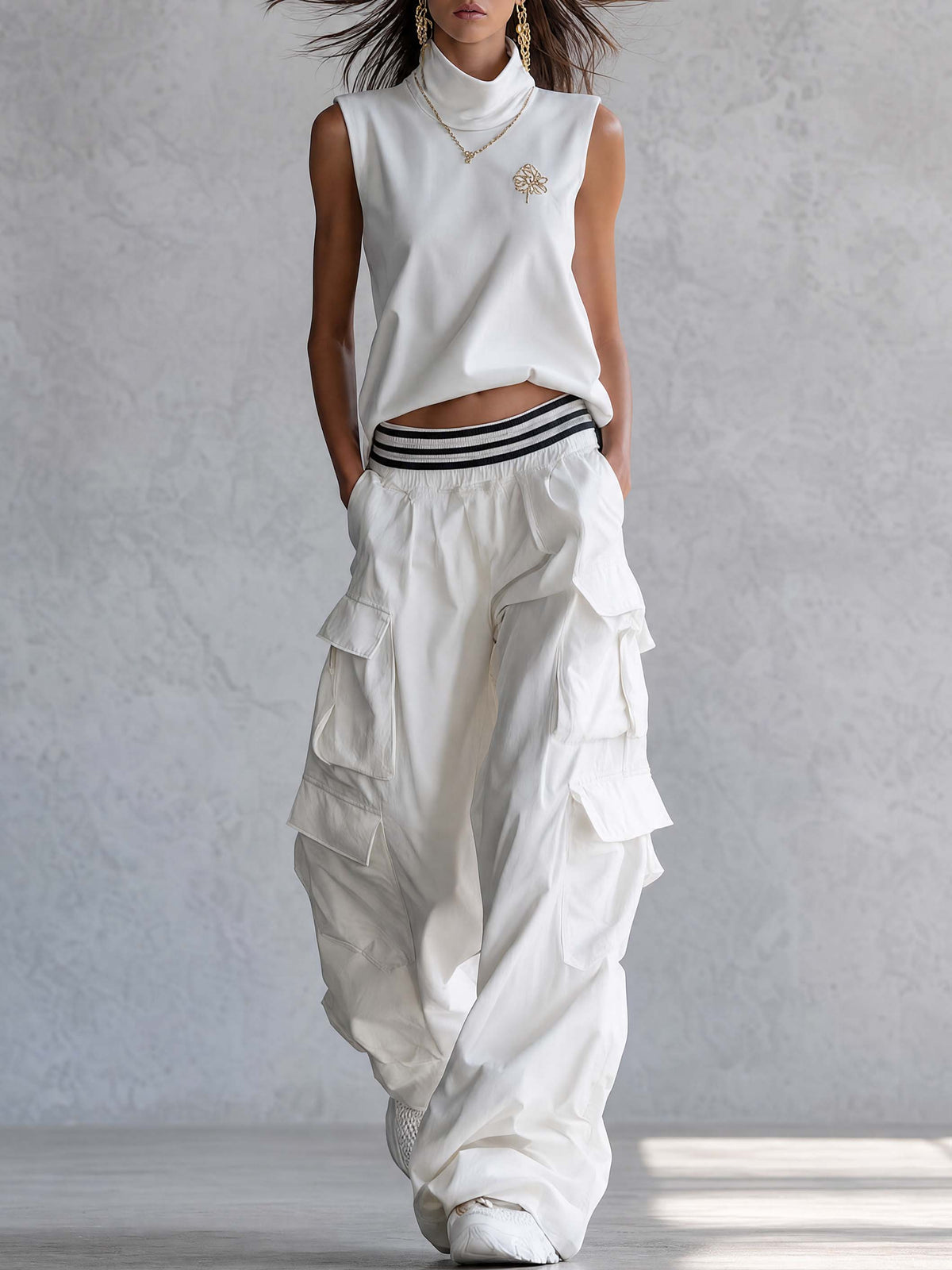 White cotton sleeveless athleisure top with mock neck and matching pants from Oyrosy Clothing, perfect for activewear or casual styling.