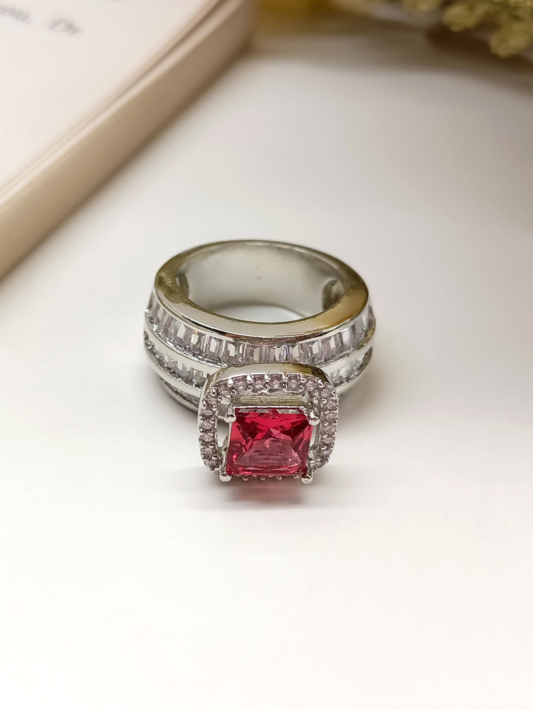 Close up of Jashn Ruby American Diamond Finger Ring with intricate details and sparkling stones