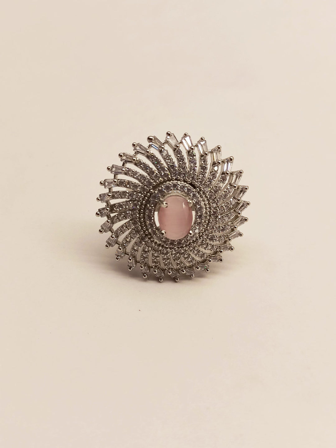 Beautiful round baby pink silver ring with intricate design and sparkling gemstone detail