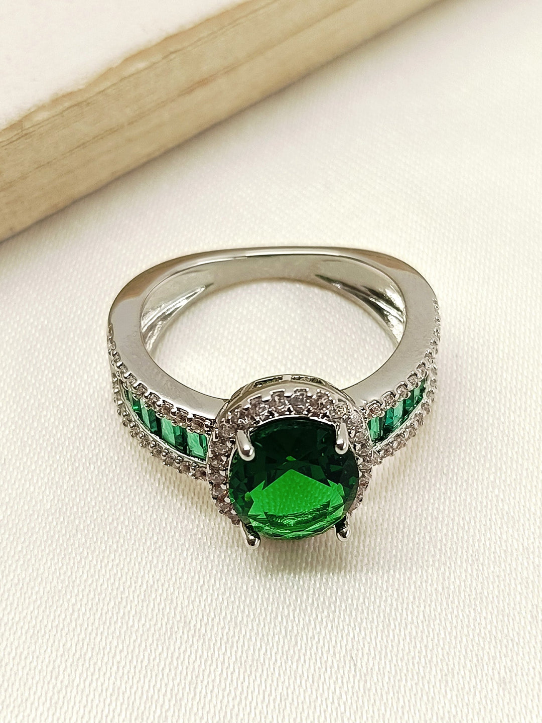 Adika Green American Diamond Finger Ring with intricate leaf design and sparkling stones