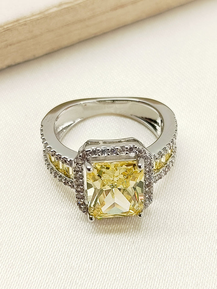 Shiny Akyli Yellow American Diamond Finger Ring displayed on a white background