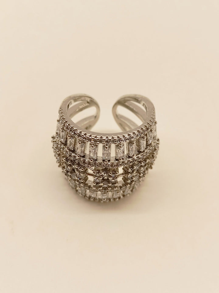 Shiny silver finger ring with intricate Mukku American diamond design and sparkling gemstones