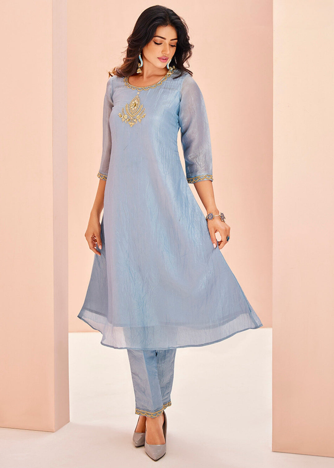 Beautiful pastel blue organza kurta with intricate handwork paired with matching pants