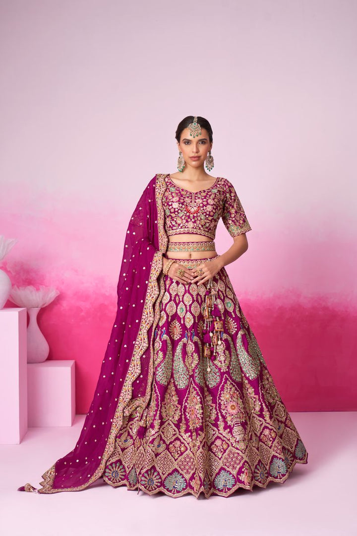 Pure silk burgundy bridal lehenga with intricate moti and sequin embroidery