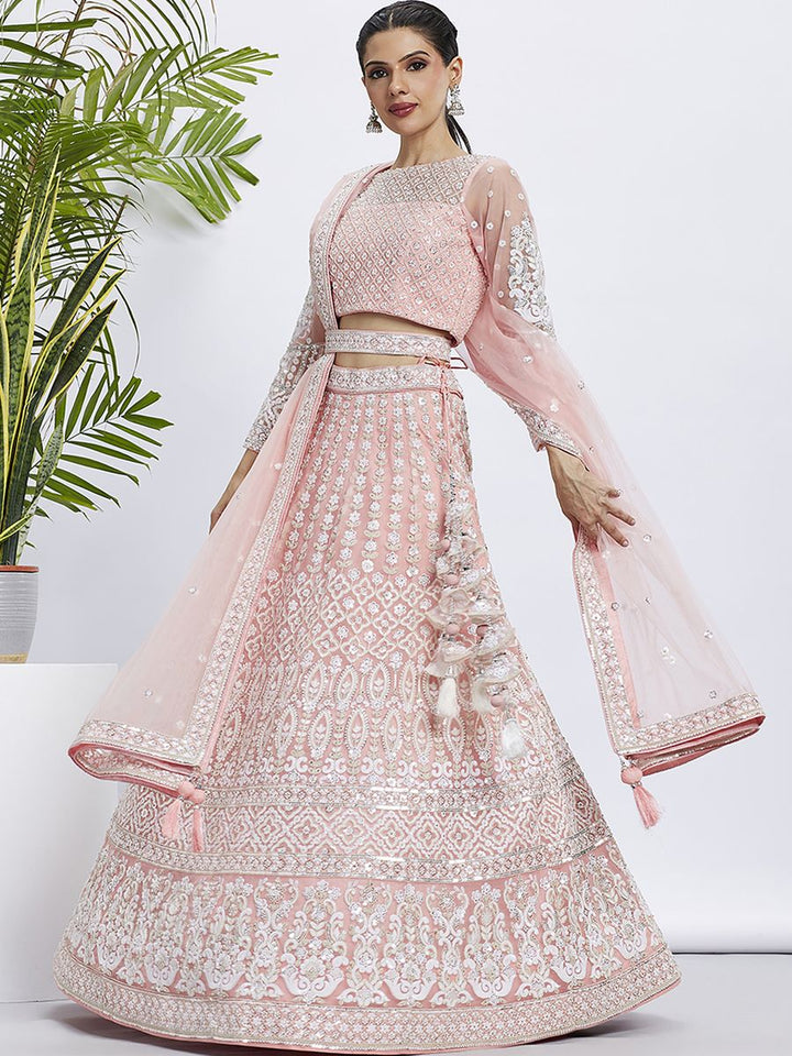 Peach net semi-stitched lehenga choli with white sequins and heavy embroidery