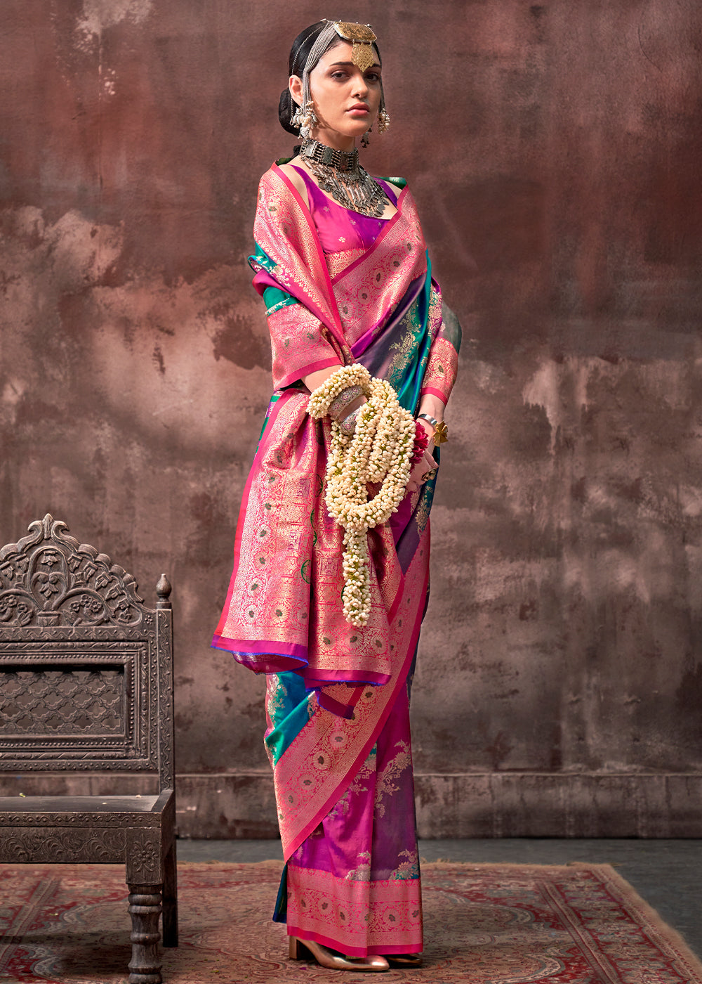  Close-up of intricate handwoven details on Blue and Pink Handloom Silk Saree