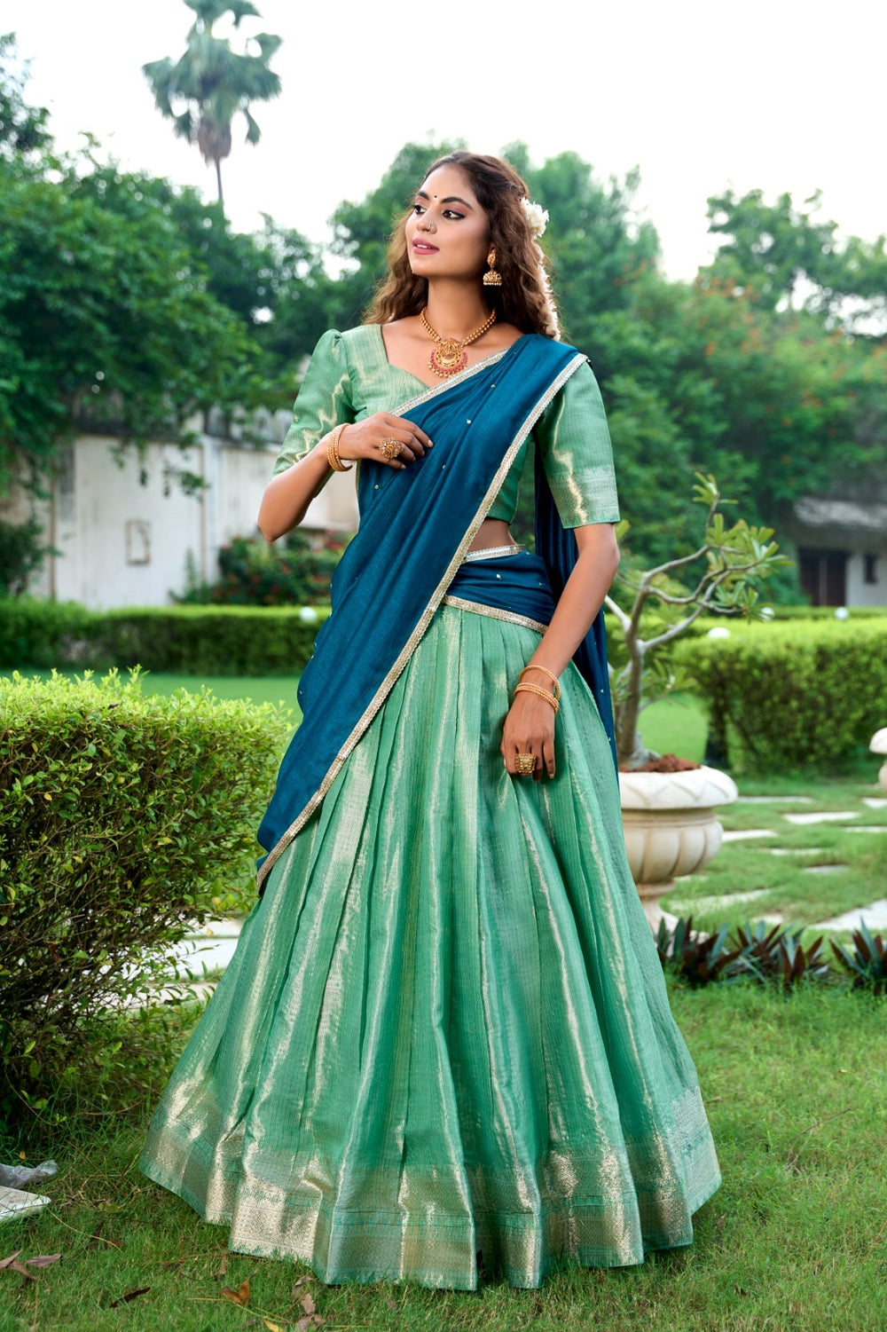 Traditional Pista color lehenga with Kanchipuram zari weaving and detailed floral patterns