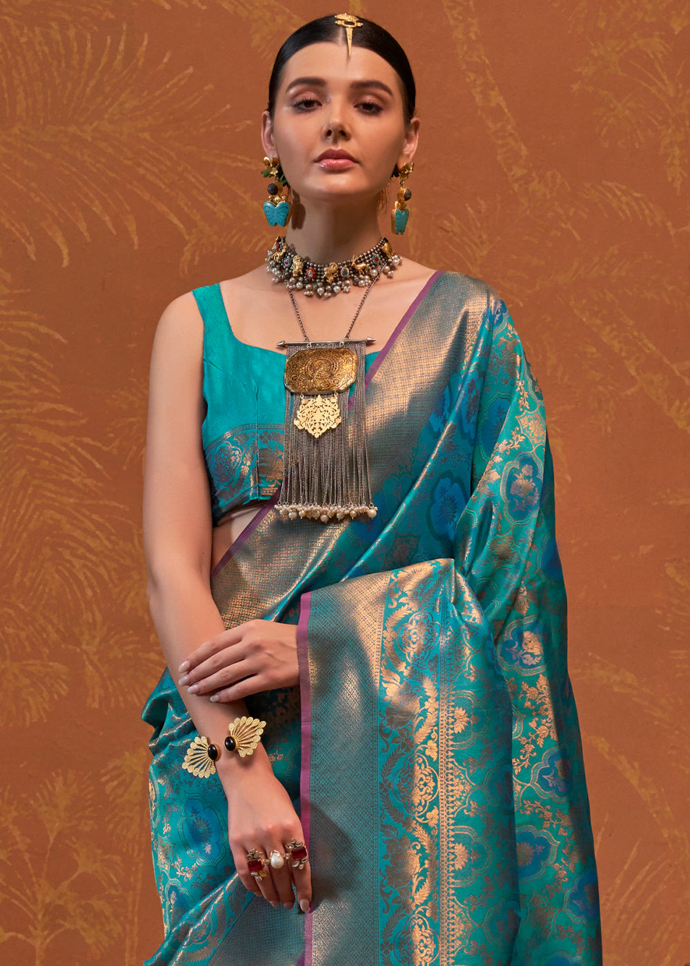 Handloom woven designer silk saree in shades of blue with intricate patterns