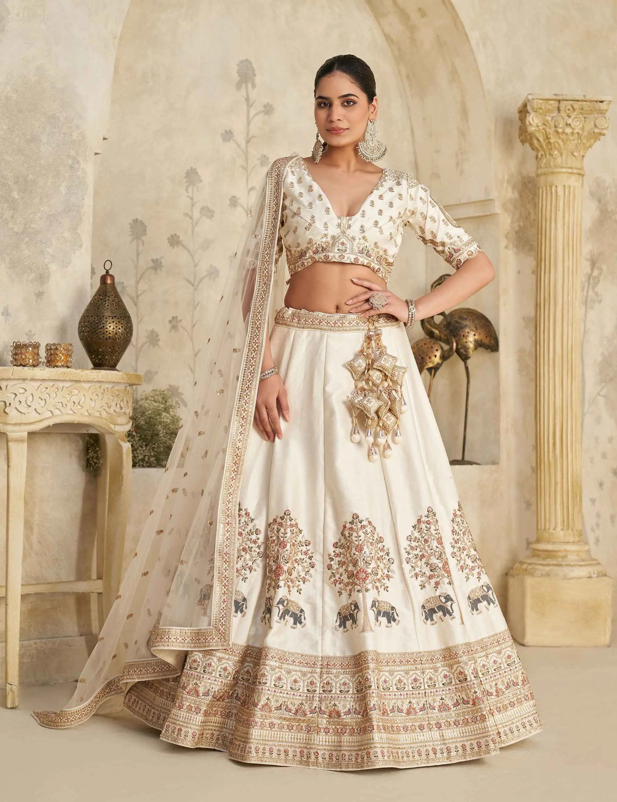 Cream Lehenga with Intricate Elephant Zari Work - qivii