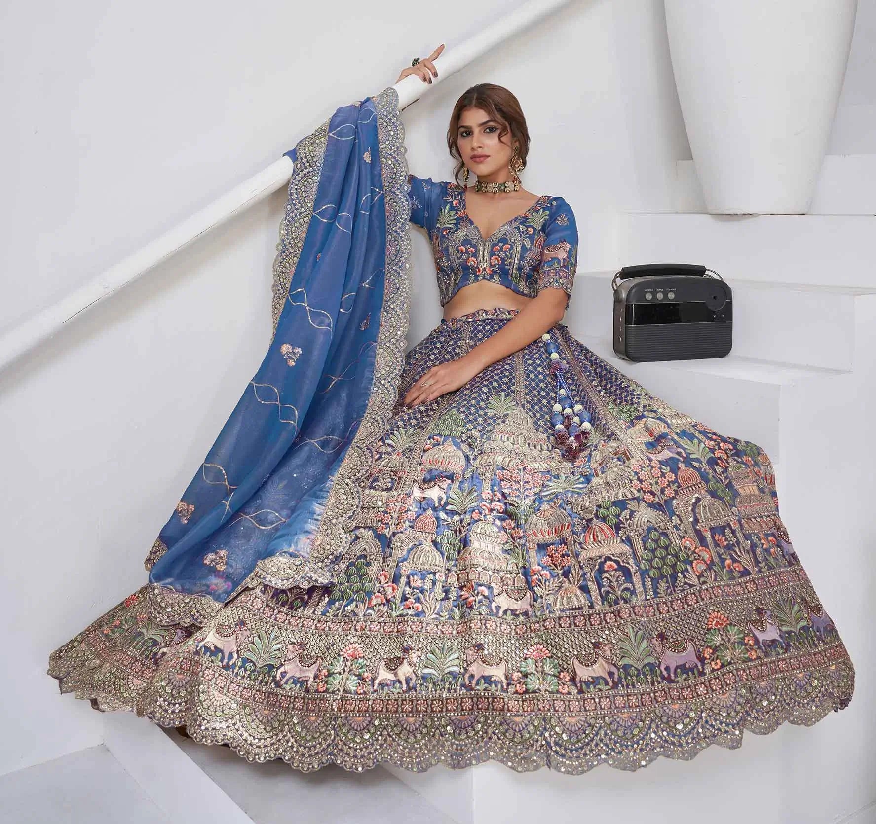 Dusty Blue Bridal Lehenga With Temple & Cow Motifs - qivii