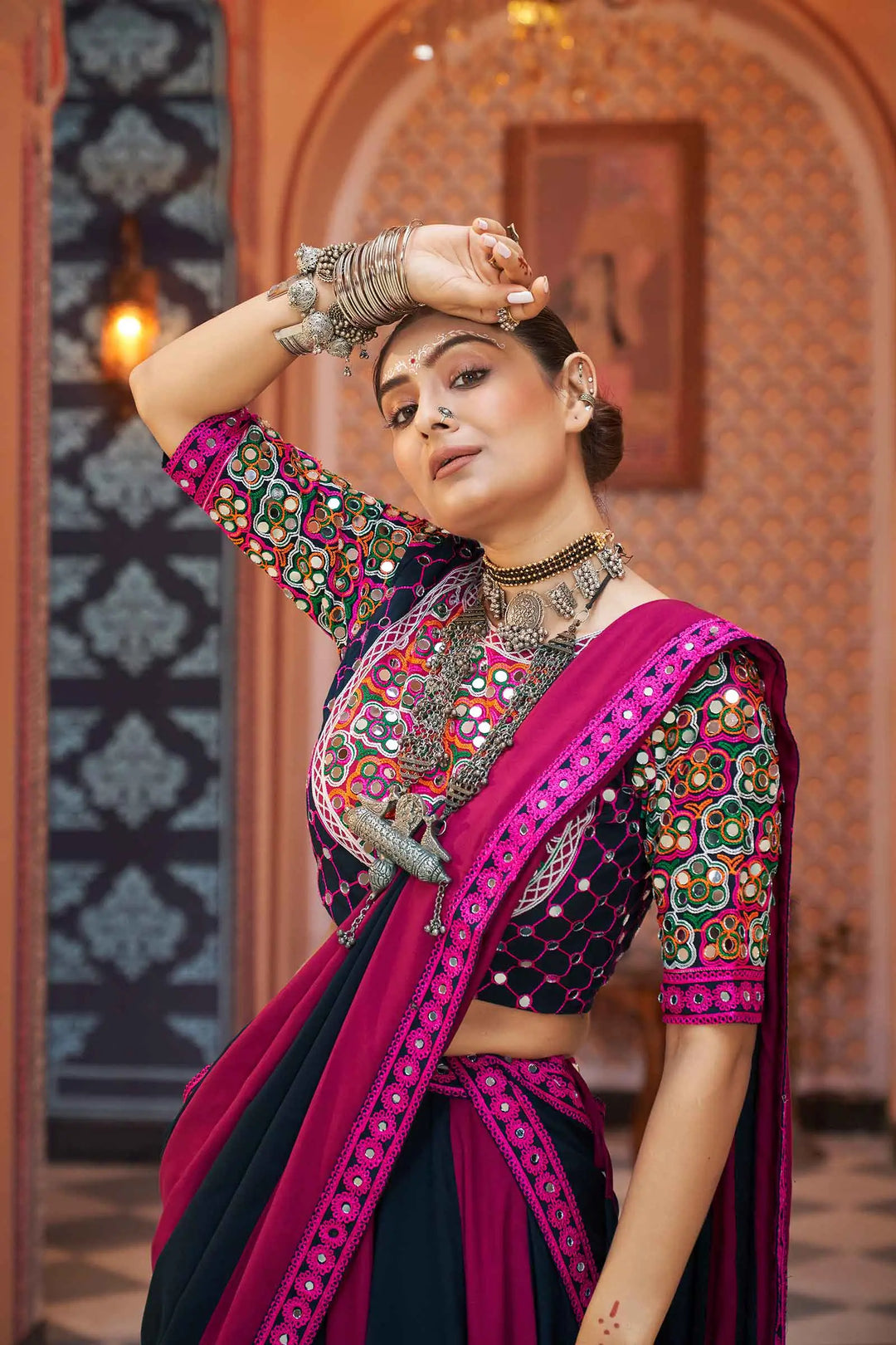 Beautiful and vibrant Magenta Red Navratri Lehenga adorned with intricate embroidery and stunning mirror work