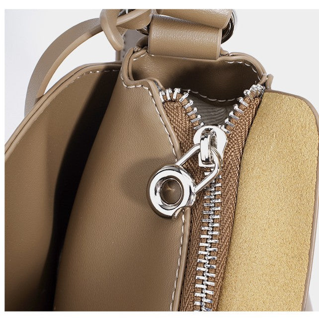 Women's Hush Rider Bucket — Genuine Leather Saddle Bag with Signature Lock Fastening & Convertible Shoulder Strap