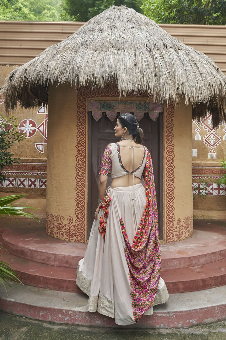 Elegant beige lehenga with all-over mirror work and viscose embroidery