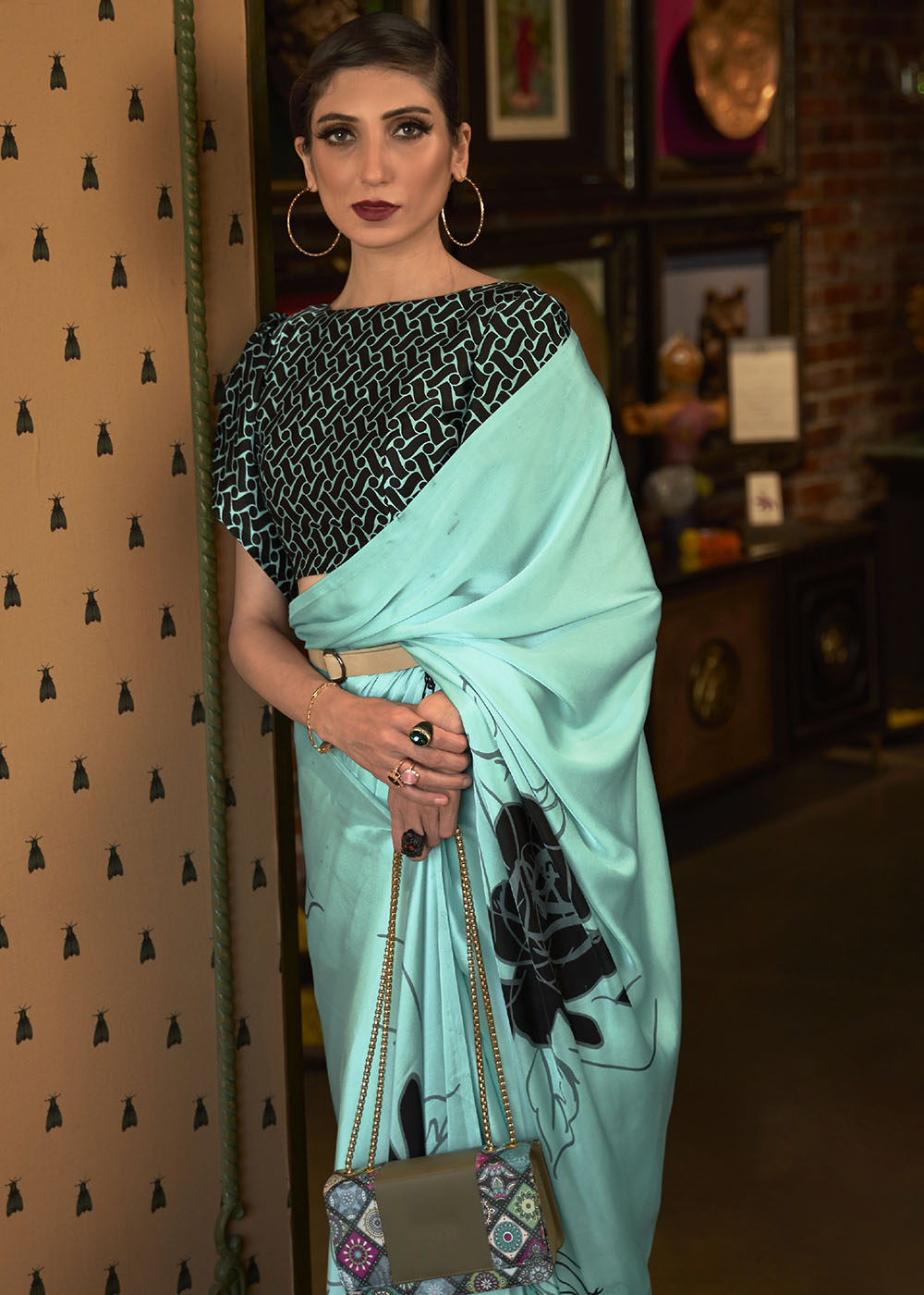 Beautiful turquoise blue designer satin crepe printed saree with intricate patterns