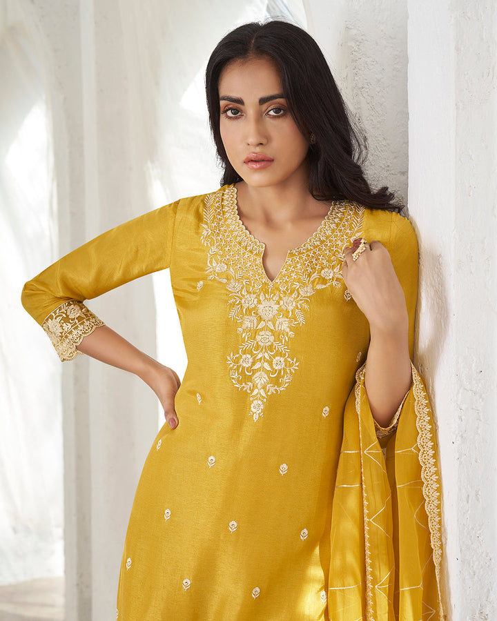 Amber Yellow Dola Silk Kurta . Paired with Santoon Straight Pants and Organza Dupatta