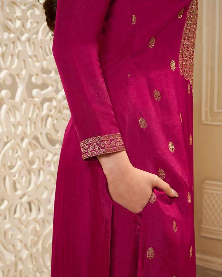 Magenta Pink Dola Silk Kurta . Paired with Santoon Straight Pants and Chinon Floral Printed Dupatta.