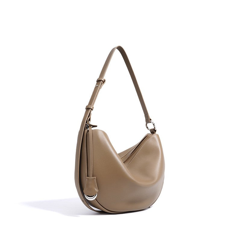 Women's Hush Rider Bucket — Genuine Leather Saddle Bag with Signature Lock Fastening & Convertible Shoulder Strap