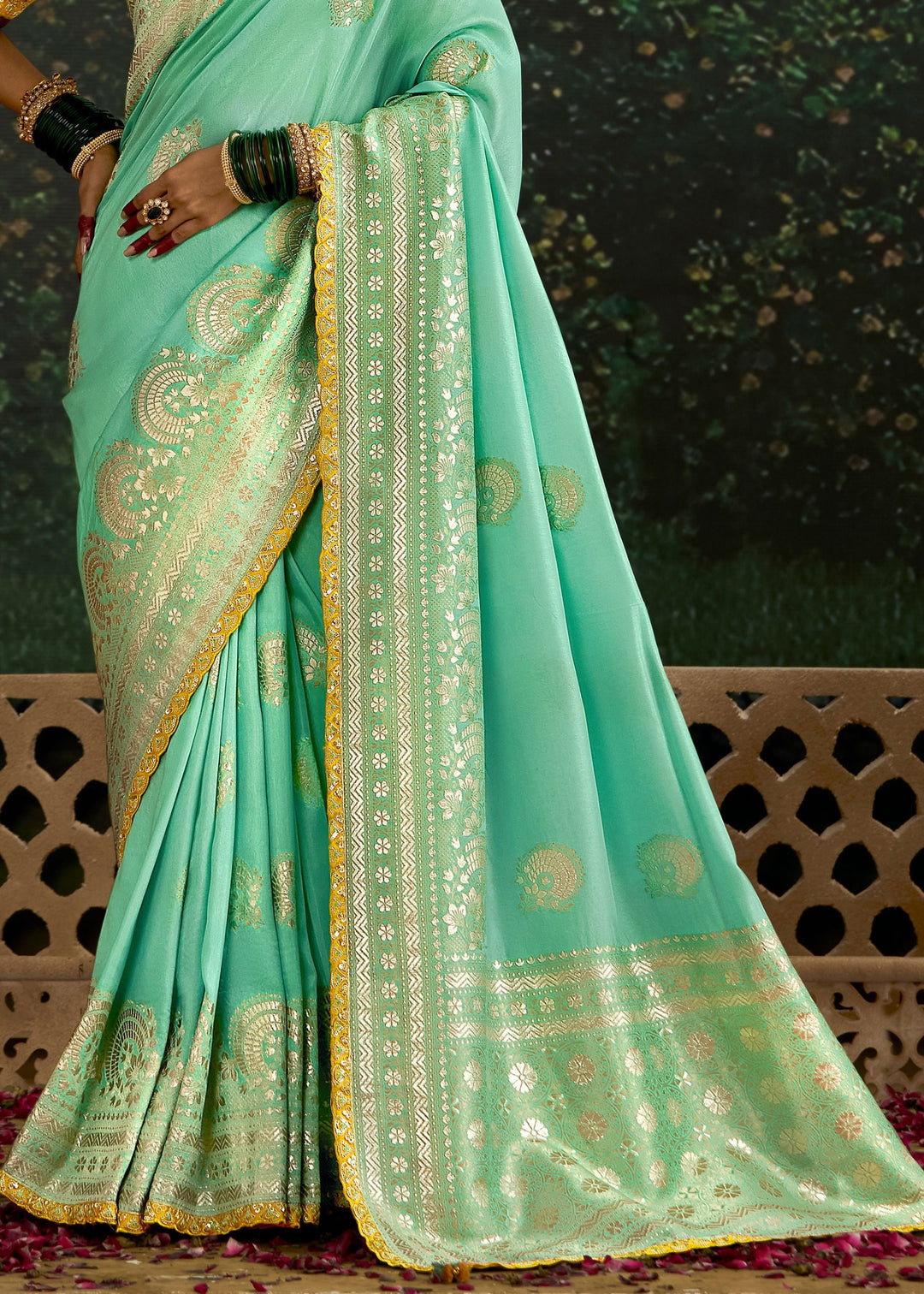 A beautiful pastel and yellow viscose silk saree featuring intricate zari work