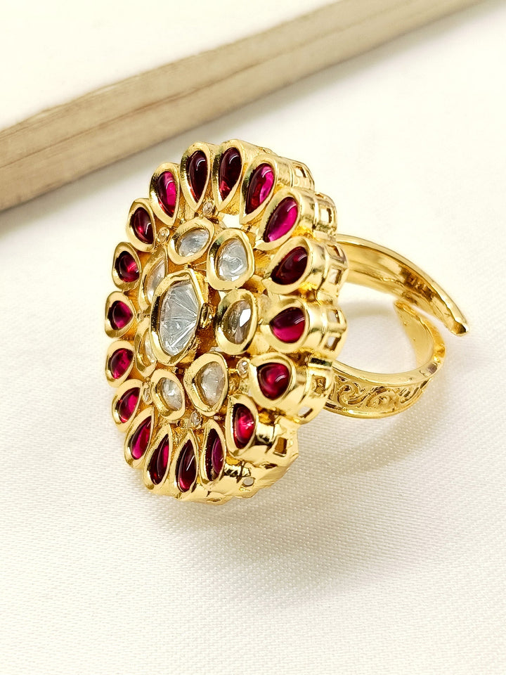 Yashfreen Maroon Kundan Finger Ring displayed on a velvet cushion, highlighting its elegance and beauty