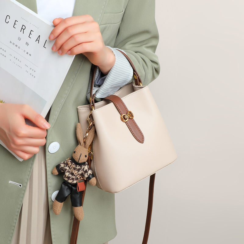 Women’s Bunny Charm Bucket Satchel — Cowhide Leather Convertible with Sculptural Clasp & Signature Whimsy