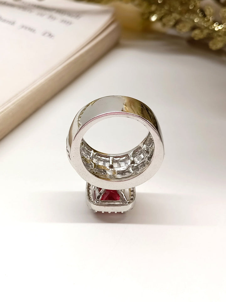  Elegant Jashn Ruby American Diamond Finger Ring with red gemstone and surrounding diamonds on a woman's hand