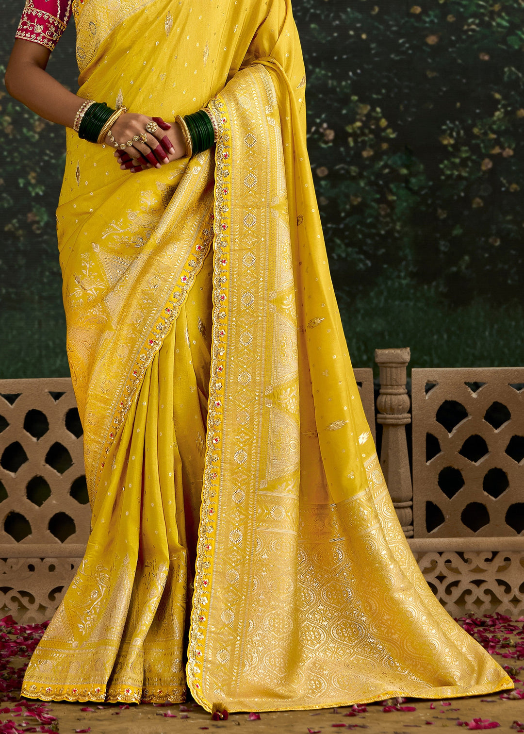 Beautiful yellow and magenta zari silk saree with intricate designs and patterns