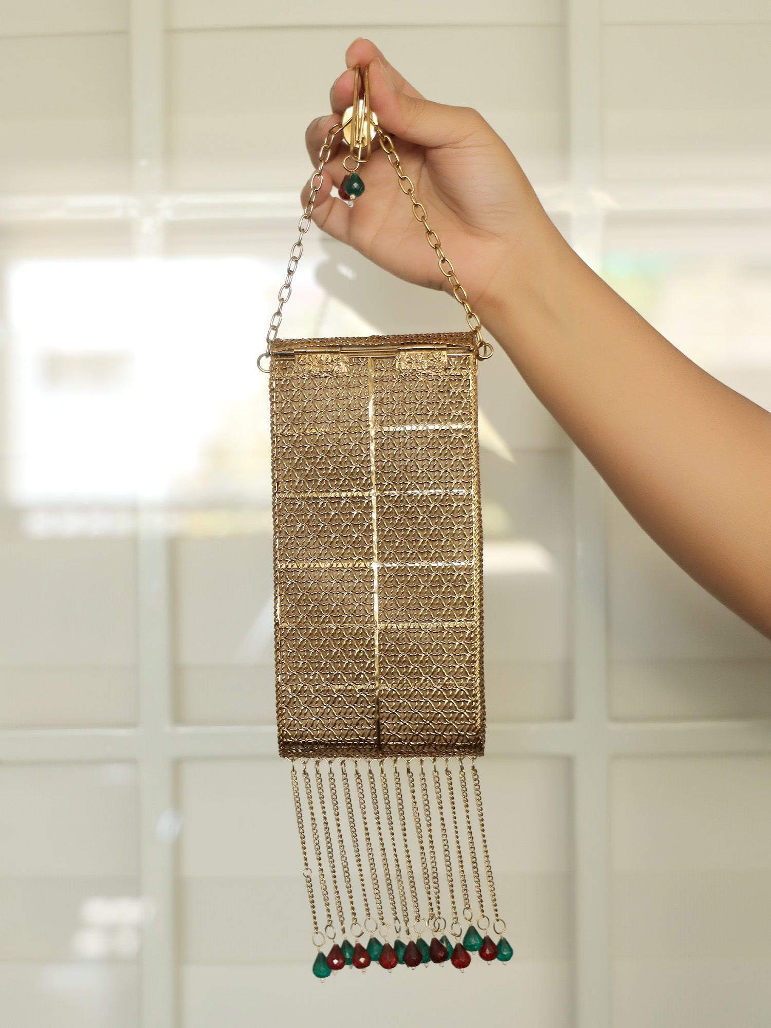 Shristi Golden Mobile Pouch - qivii
