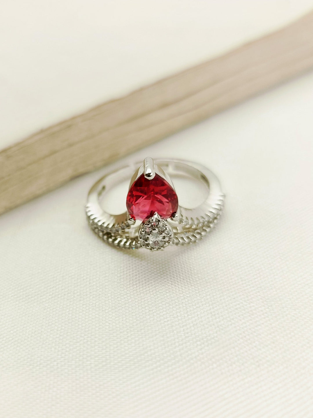 Beautiful maroon American diamond finger ring with intricate detailing and elegant design