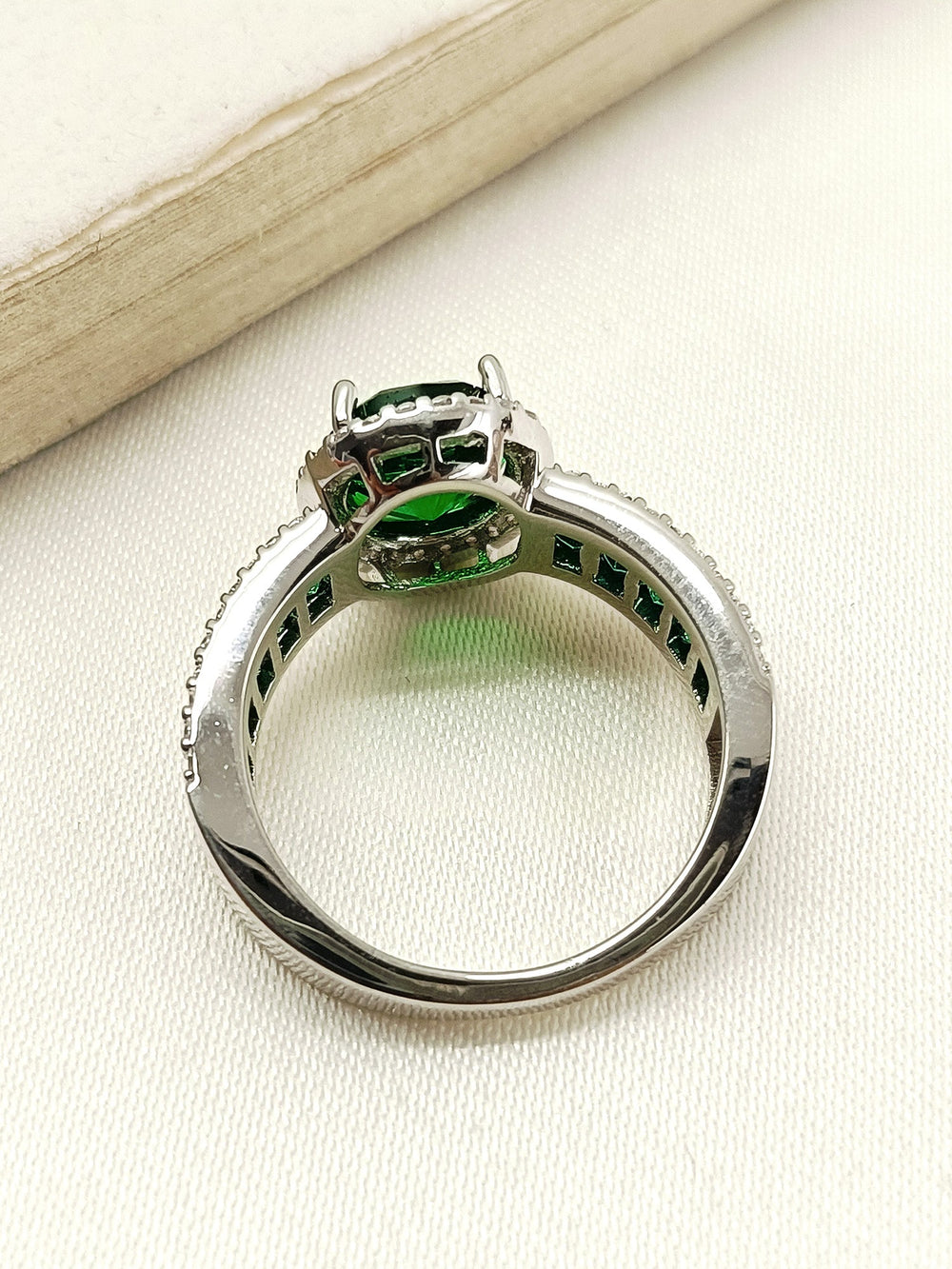 Green American Diamond Finger Ring with intricate silver detailing and elegant design