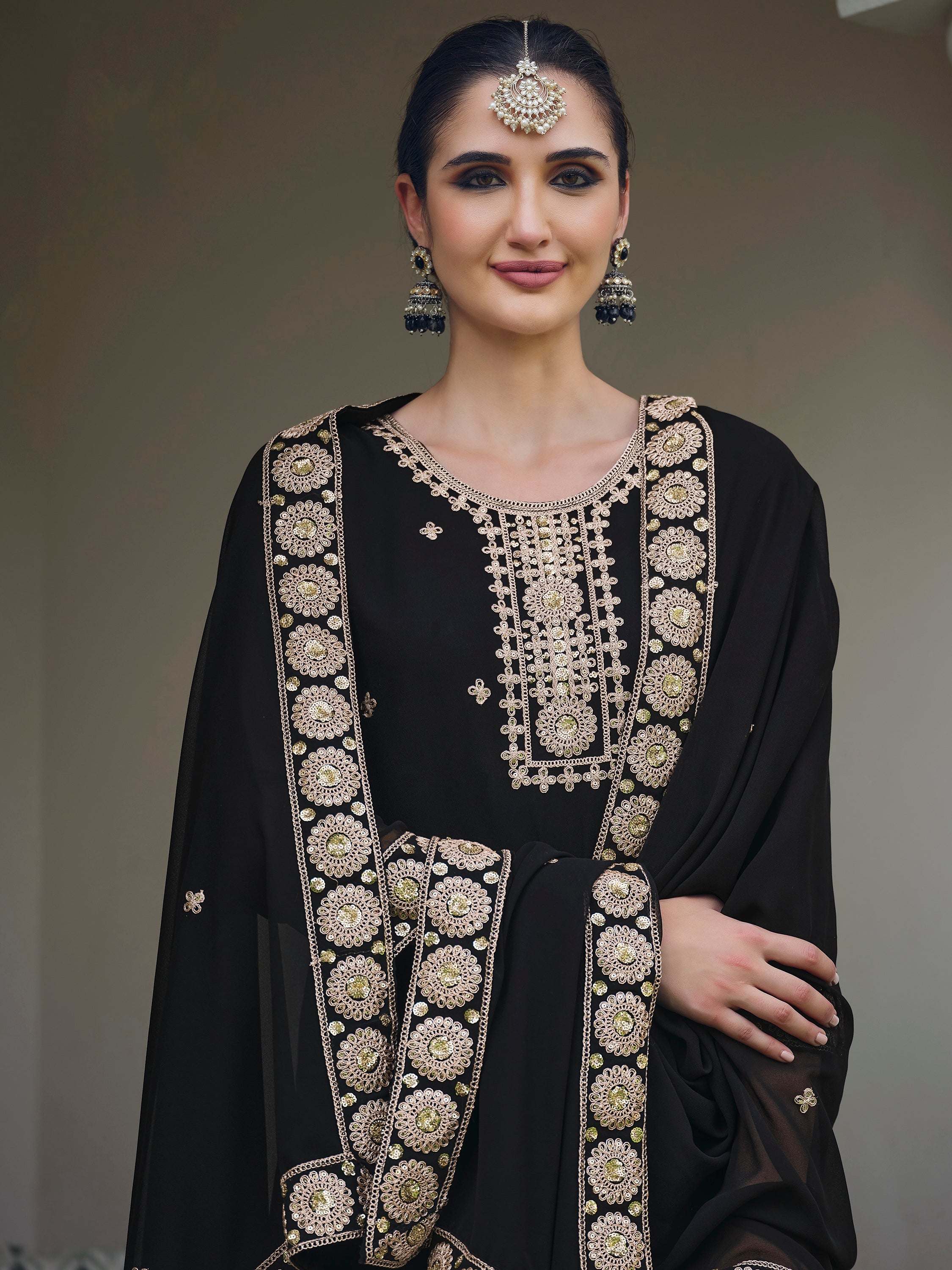 Elegant black georgette suit with exquisite sequin and embroidered detailing, tailored for a sophisticated look