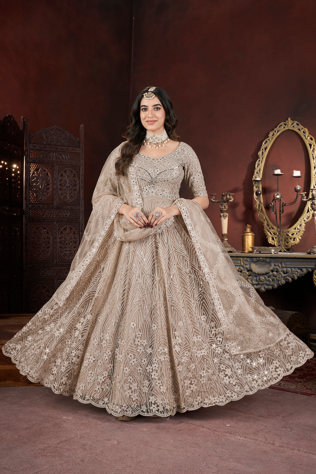 Chiku Net Embroidery and zarkan Gown with intricate floral patterns