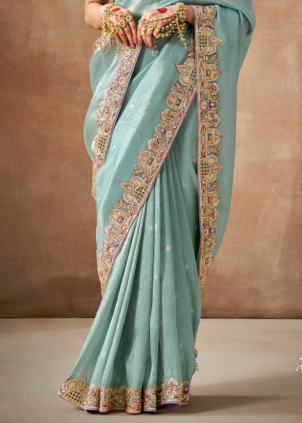 Light Blue Zari Woven Tissue Dola Silk Saree having Sequence, Pearl, Mirror & Thread Work: Festival Edition