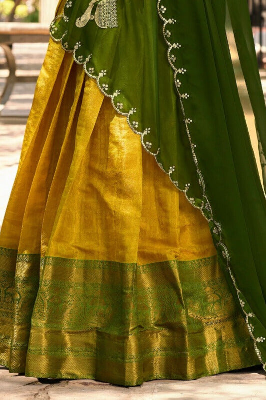 Luxurious Kanjivaram silk lehenga choli with intricate detailing in Yellow Color