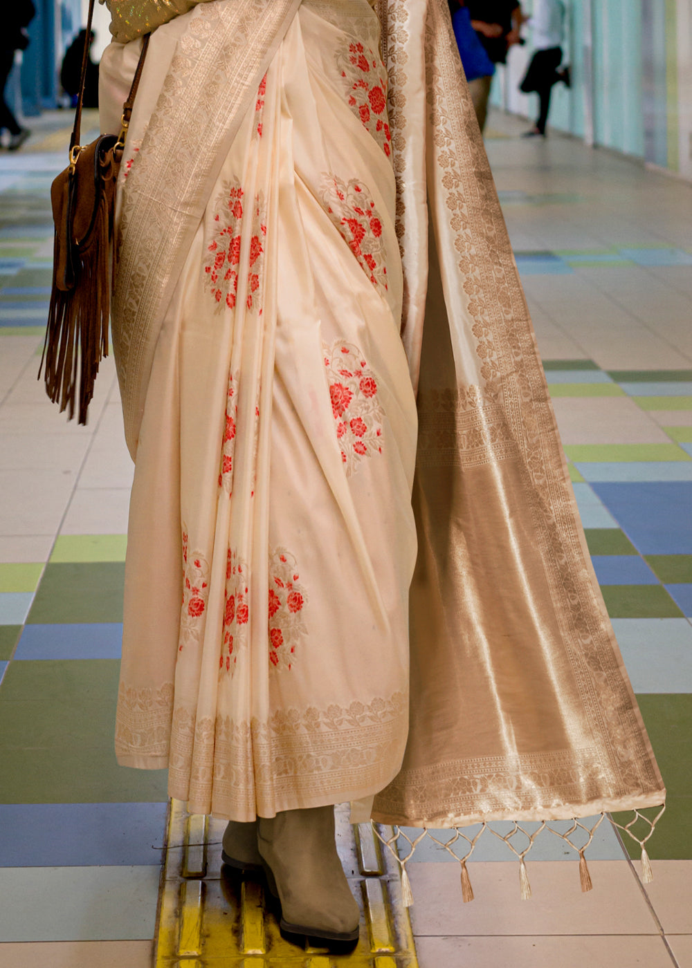 Luxurious Cream White Handloom Woven Banarasi Silk Saree with delicate embroidery and golden accents