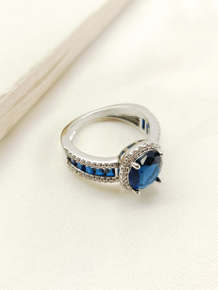 Taysha Navy Blue American Diamond Finger Ring, a stunning piece of jewelry with a deep blue stone and sparkling diamonds, perfect for special occasions and everyday wear