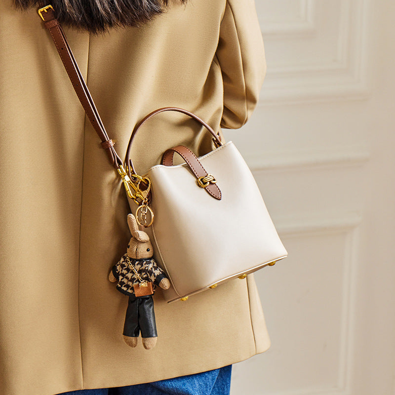 Women’s Bunny Charm Bucket Satchel — Cowhide Leather Convertible with Sculptural Clasp & Signature Whimsy
