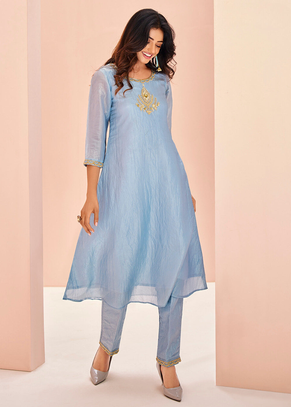 Beautiful pastel blue organza kurta with intricate handwork paired with matching pants