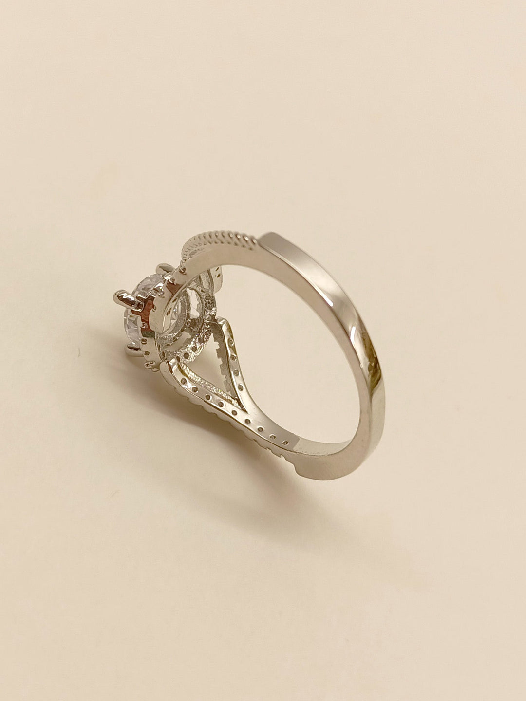 Shiny silver finger ring with a sparkling American diamond centerpiece