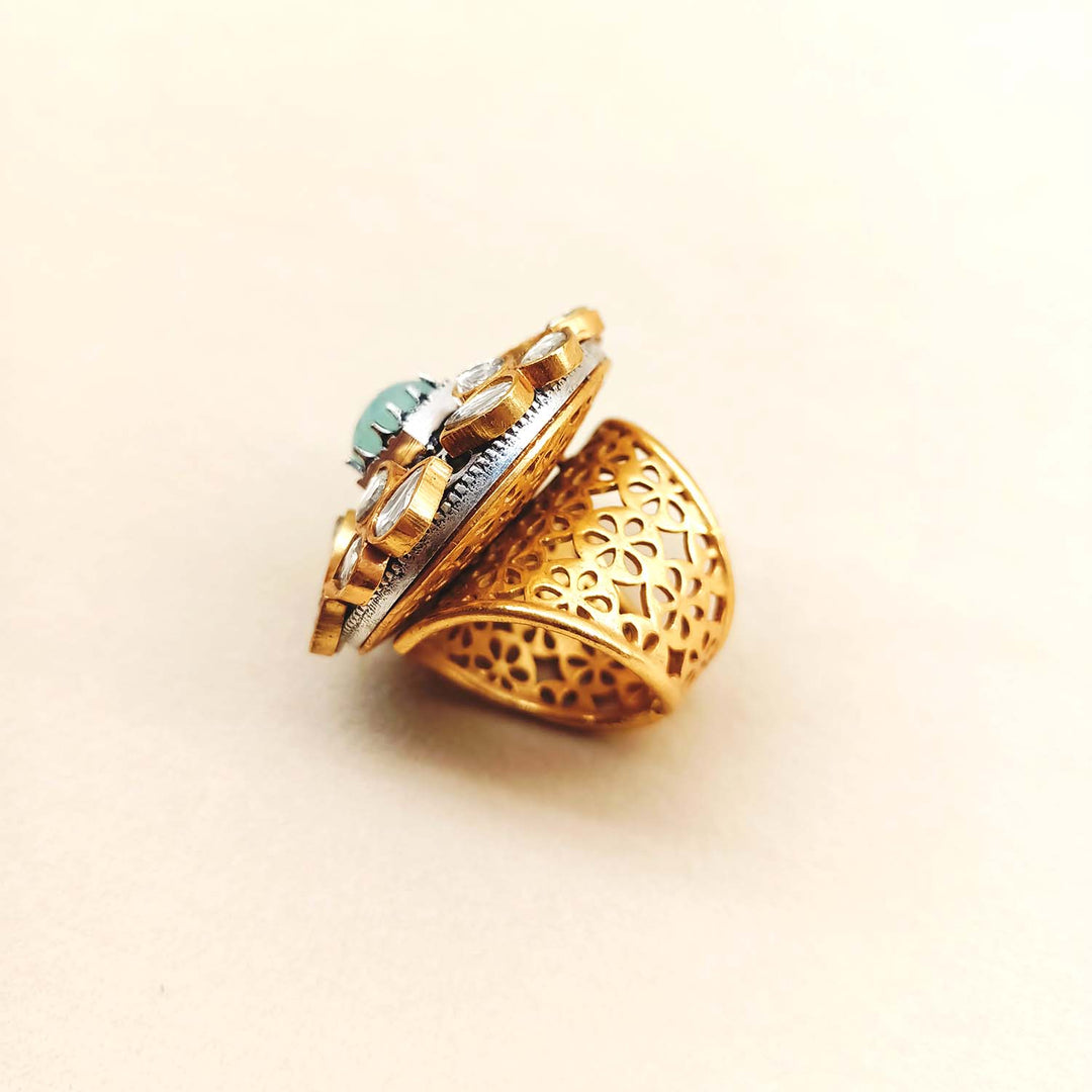  Elegant and stylish Hasina Mint Green Stone Gold Boutique Ring with a beautiful gold band and eye-catching green stone on a model's hand