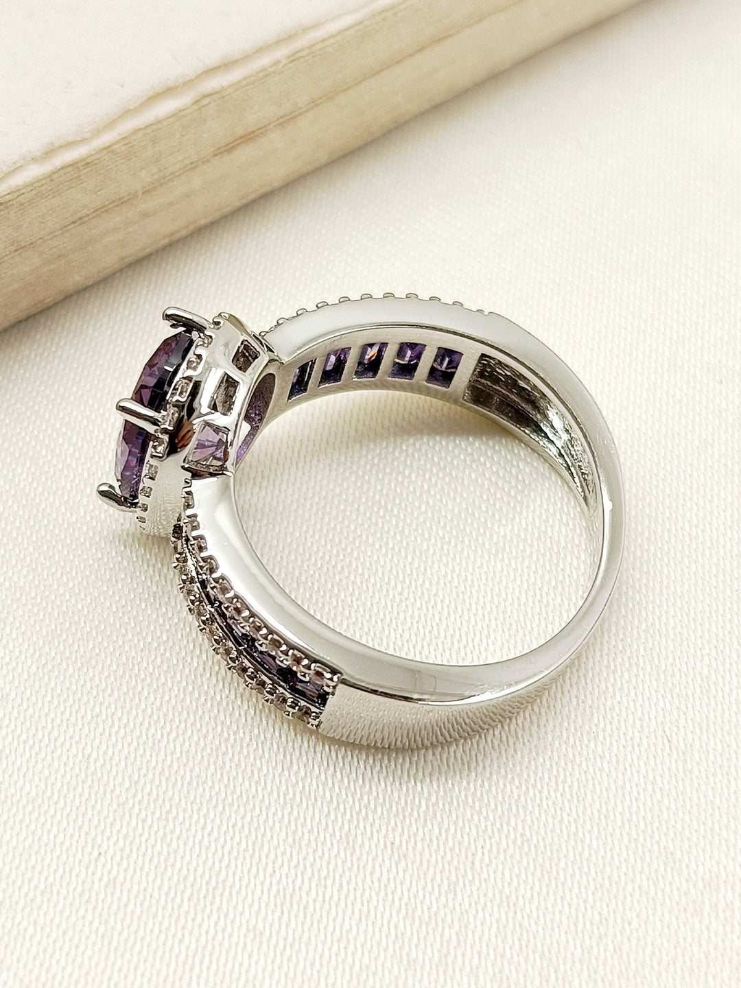 Elegant and Eye-Catching Dimple Purple American Diamond Finger Ring on Woman's Hand with Sparkling Gemstones