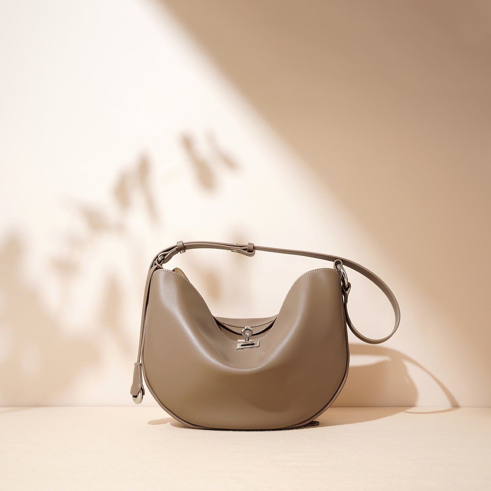 Women's Hush Rider Bucket — Genuine Leather Saddle Bag with Signature Lock Fastening & Convertible Shoulder Strap