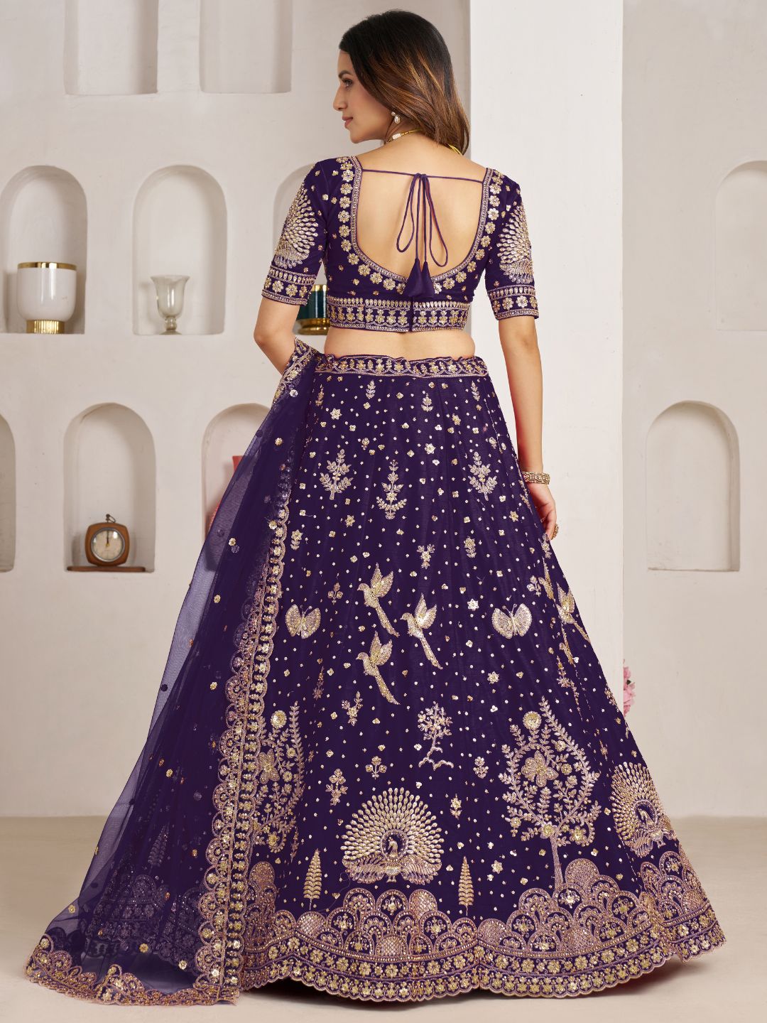 Luxurious Purple Lehenga Featuring Intricate Floral and Bird Designs
