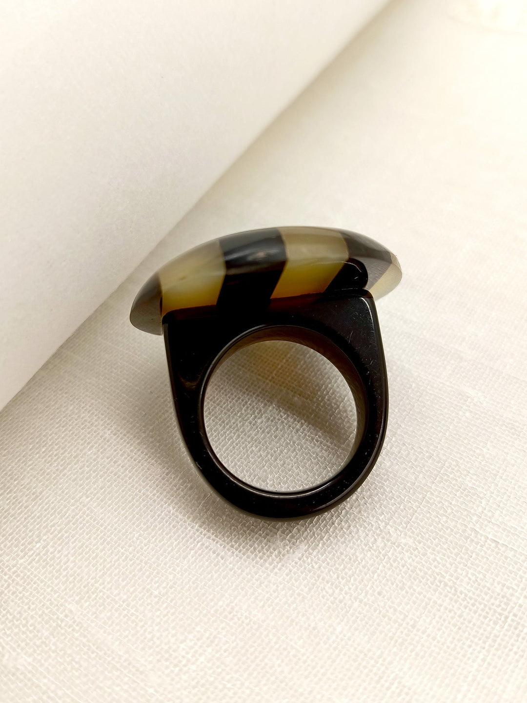  Stylish and modern Yohani Beige Round Shape Acrylic Finger Ring displayed on a white background