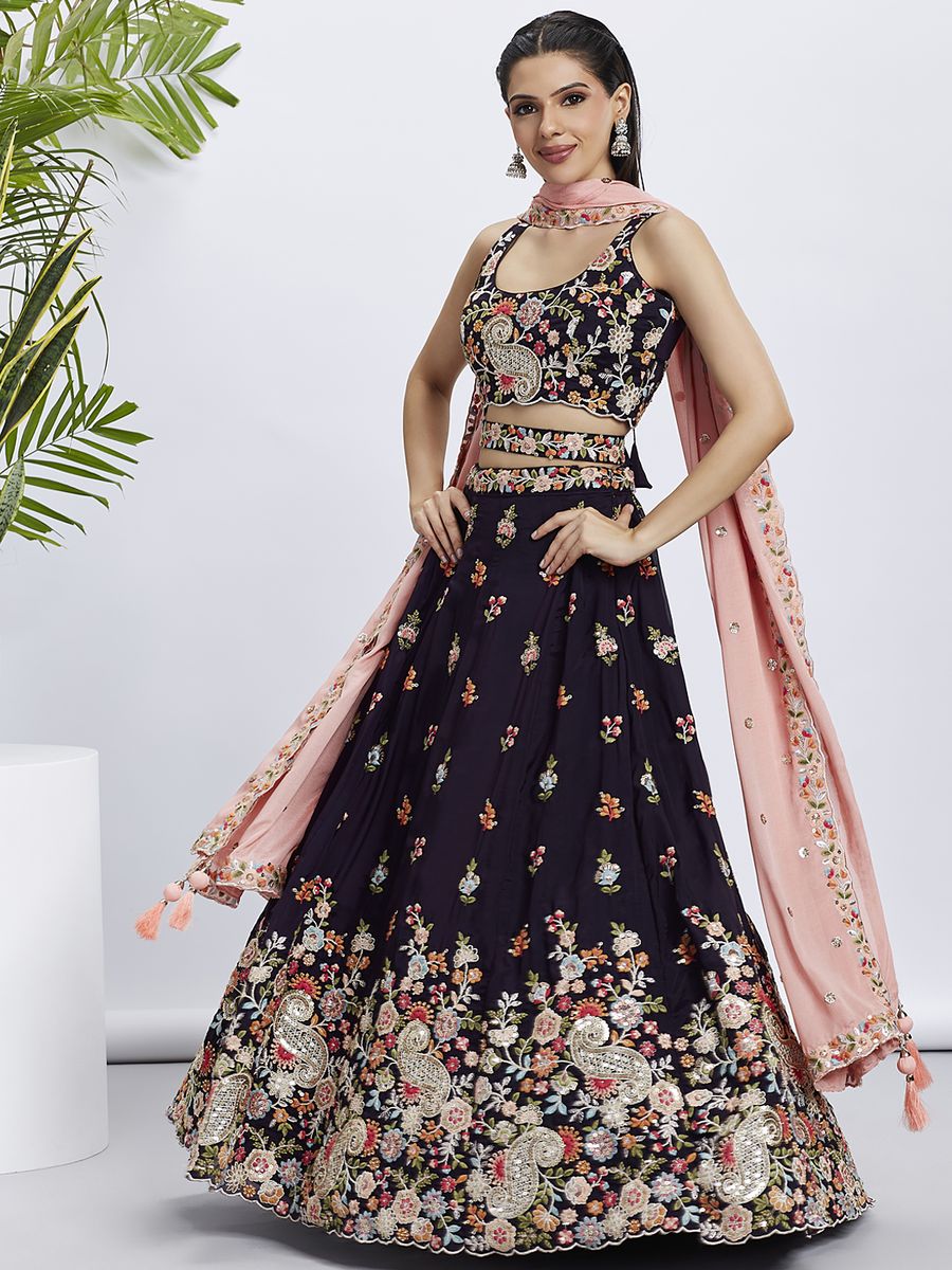 Alt text: Magenta lehenga choli with golden sequins and multi-color thread embroidery on organza fabric