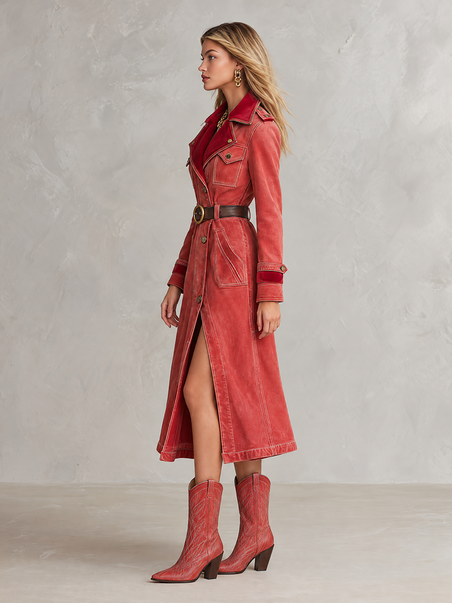 Vintage women's denim trench coat by Oyrosy Clothing with red velvet collar, belted waist, and button front detail.